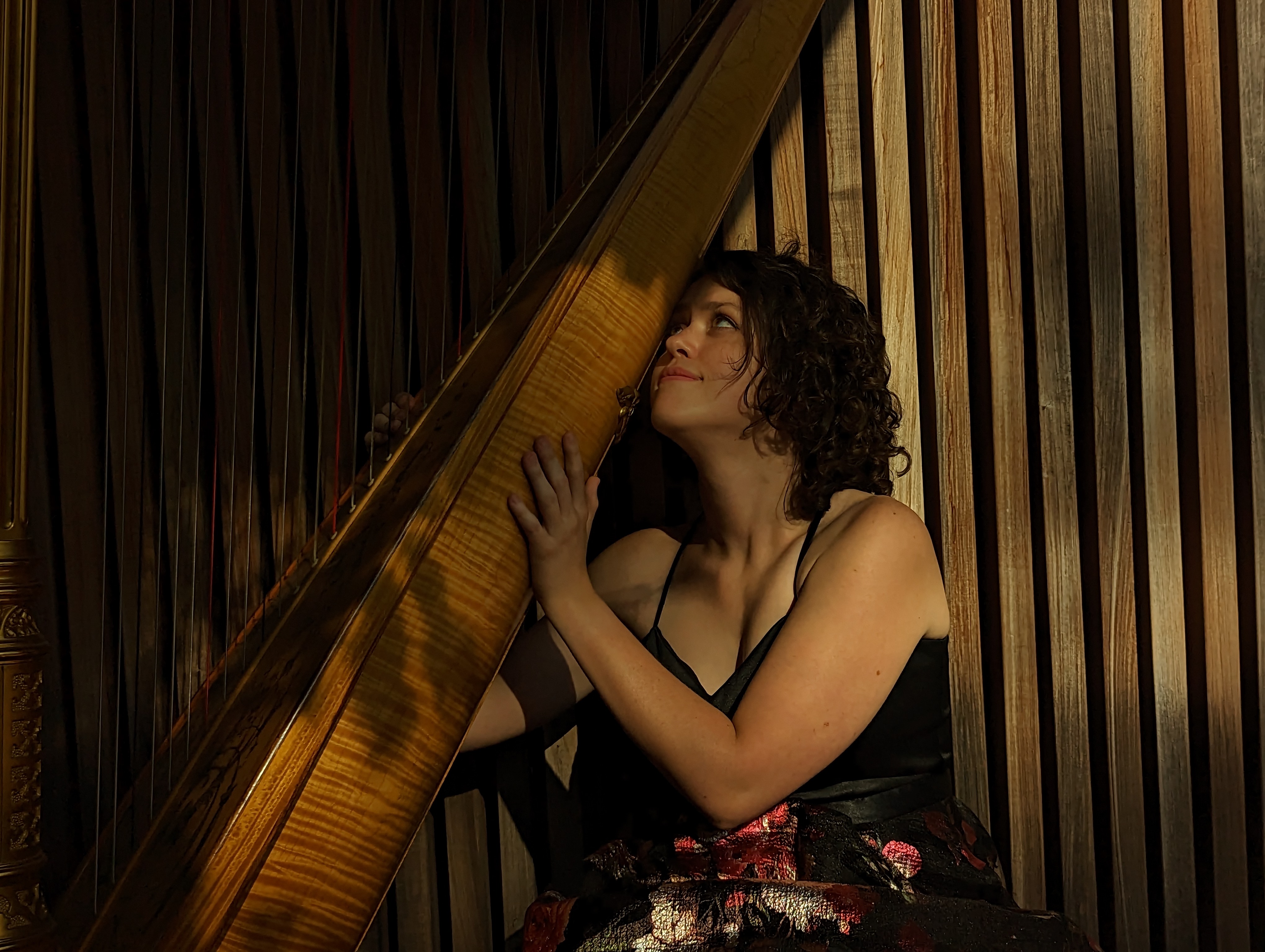 Kaitlin Miller on stage with harp